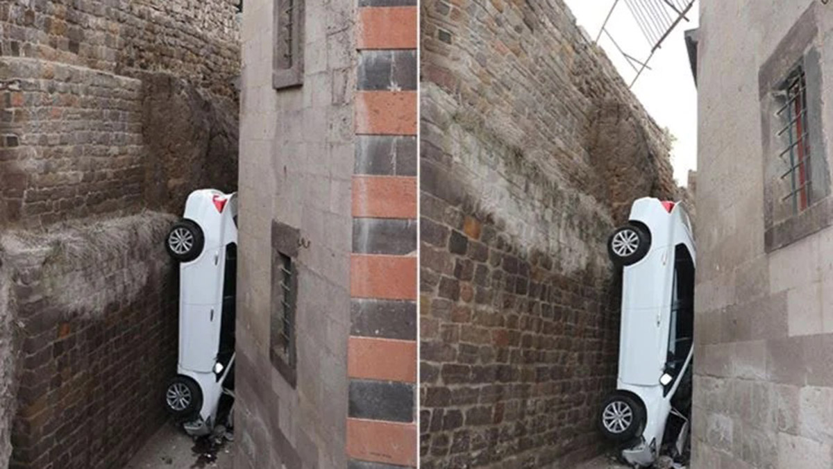 5 metreden düşen otomobil 2 duvar arasına sıkıştı
