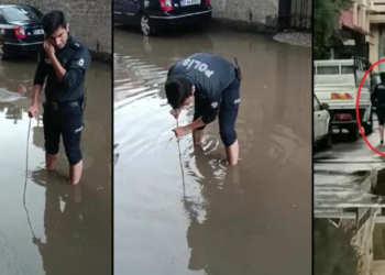 cYağmurda tıkanan kanalizasyonu komiser açtı
