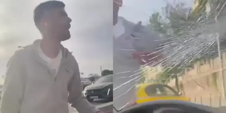 Uygulama üzerinden çağırılan aracın önünü kesip camını kırdı