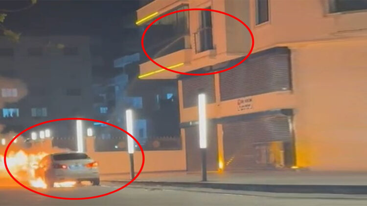 Alev alan otomobile balkondan hortumla su döktü