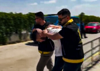 Çarşaf giyip iş yerini kurşunlayan şüpheli tutuklandı