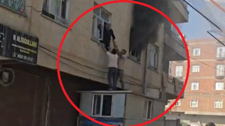 Diyarbakır'da alevlerle mücadele: Yangında mahsur kalan kadını konteynerin üzerine çıkarak kurtardılar