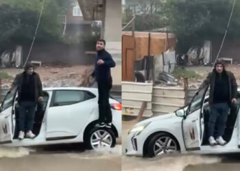 Sultanbeyli'de otomobil yağmur sonrası bir bölümü çöken yolda mahsur kaldı